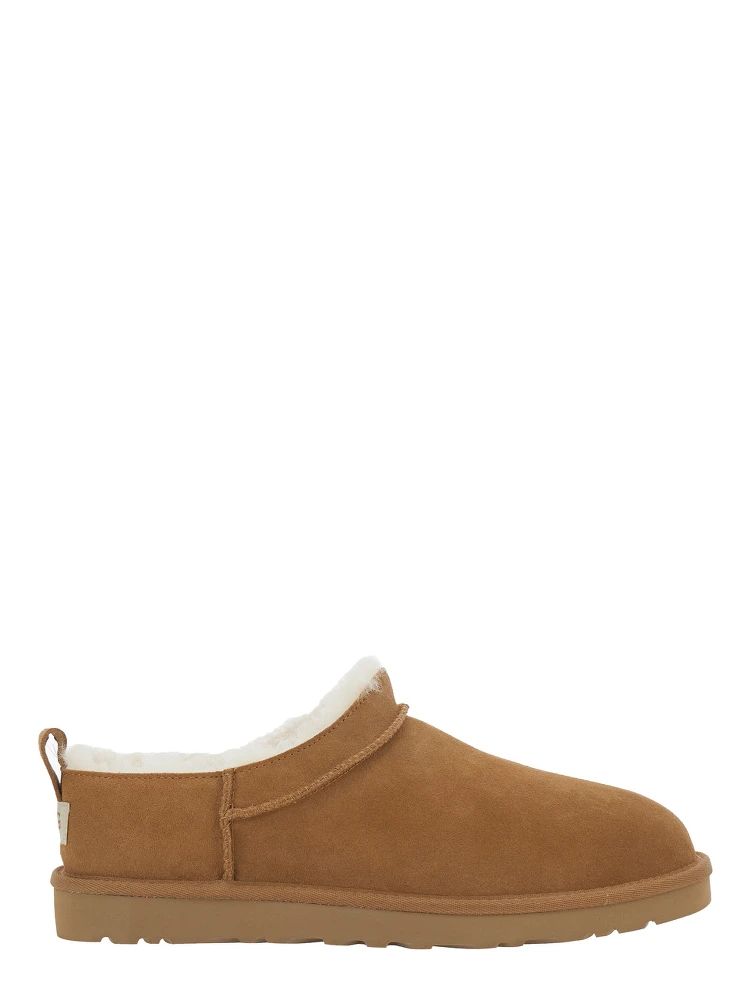 Beige Mule with logo on the side and faux fur lining in suede for men