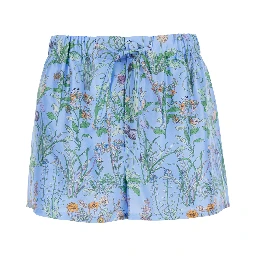 Light blue Shorts with elasticated waist and drawstring and all-over floral print in silk for women