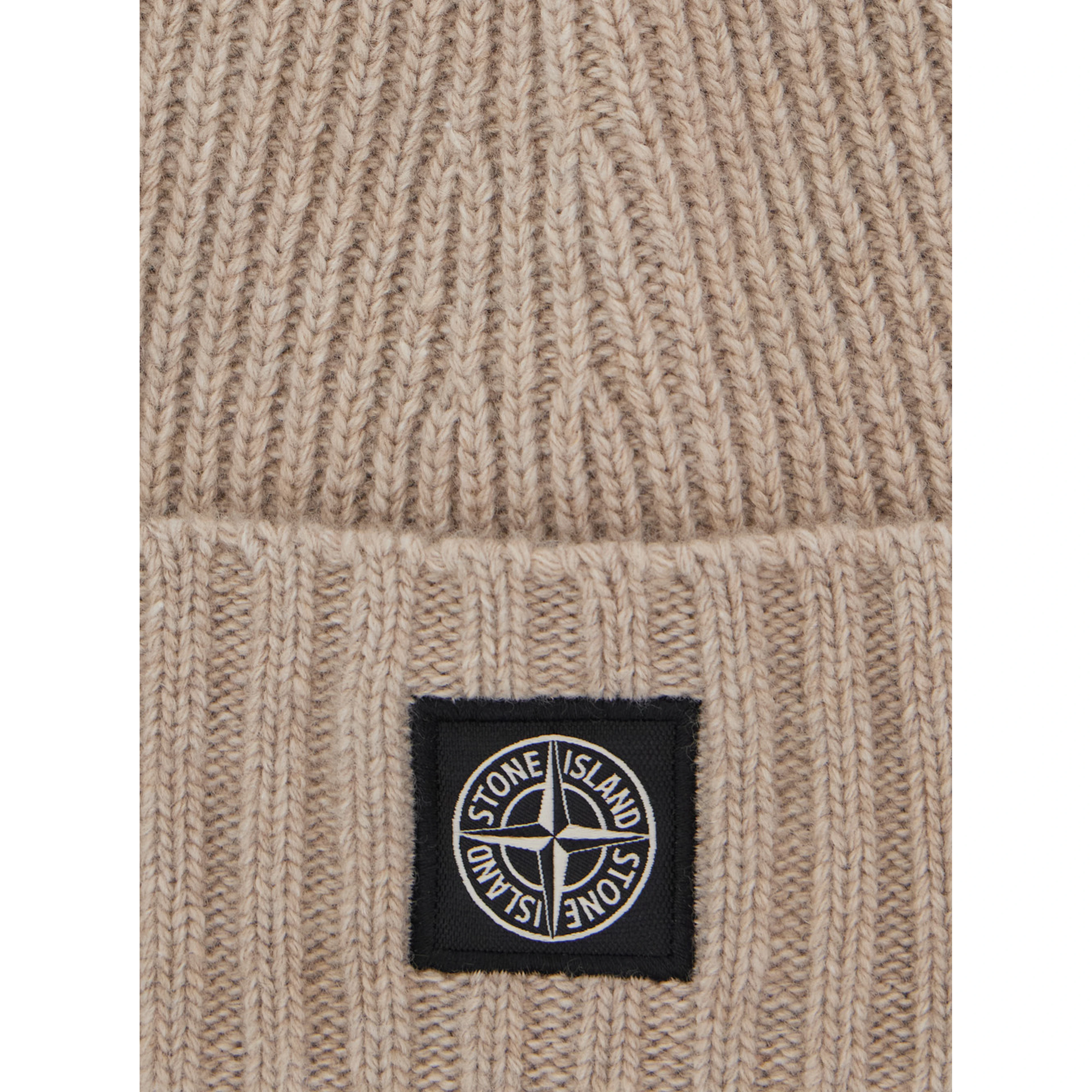 Beige beanie with turn-up brim and logo patch on the front in blend wool boy