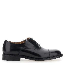 Black lace-up shoes with rounded toe and low heel in leather for men
