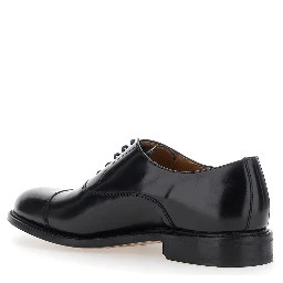 Black lace-up shoes with rounded toe and low heel in leather for men
