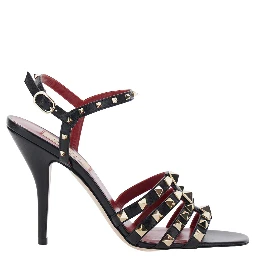 Black Heeled sandals with Rockstud embellishment and high heel in leather for women
