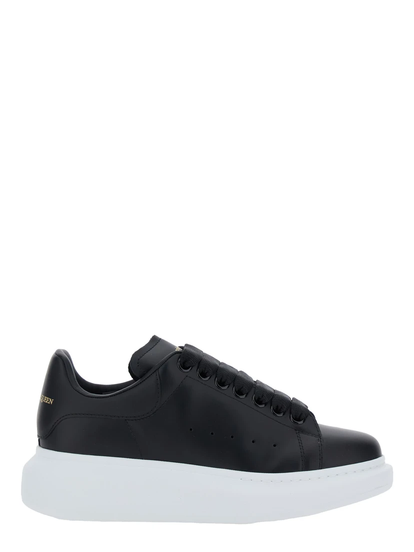 Low Top Sneakers Alexander McQueen with logo lettering on tongue and heel in black leather for women