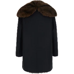 Black Parka with fur hood and button closure on the front in cotton for men