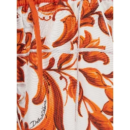 Orange shorts with all-over Maiolica print in silk for women