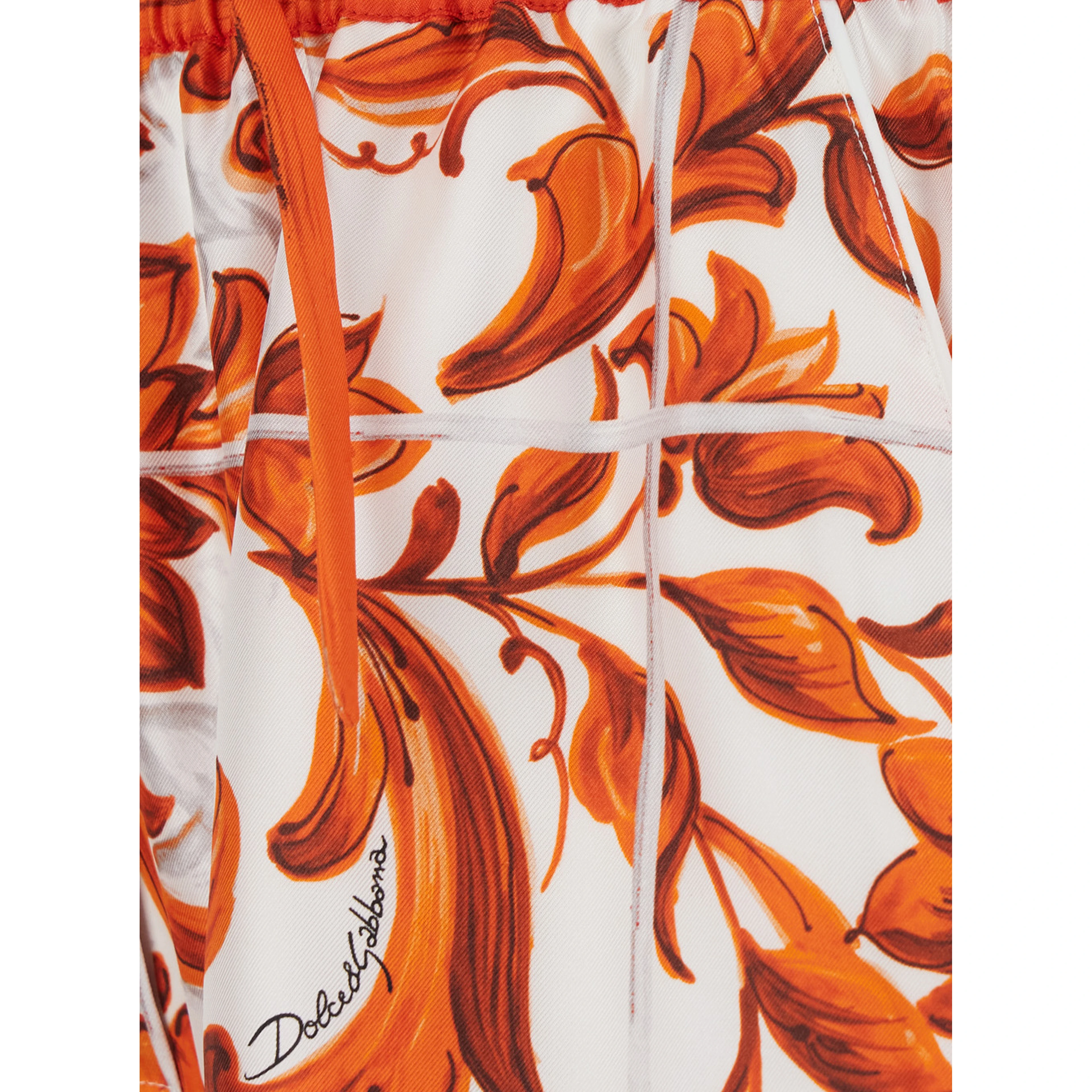 Orange shorts with all-over Maiolica print in silk for women