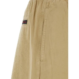 Beige pants with elasticated waist and contrasting bel