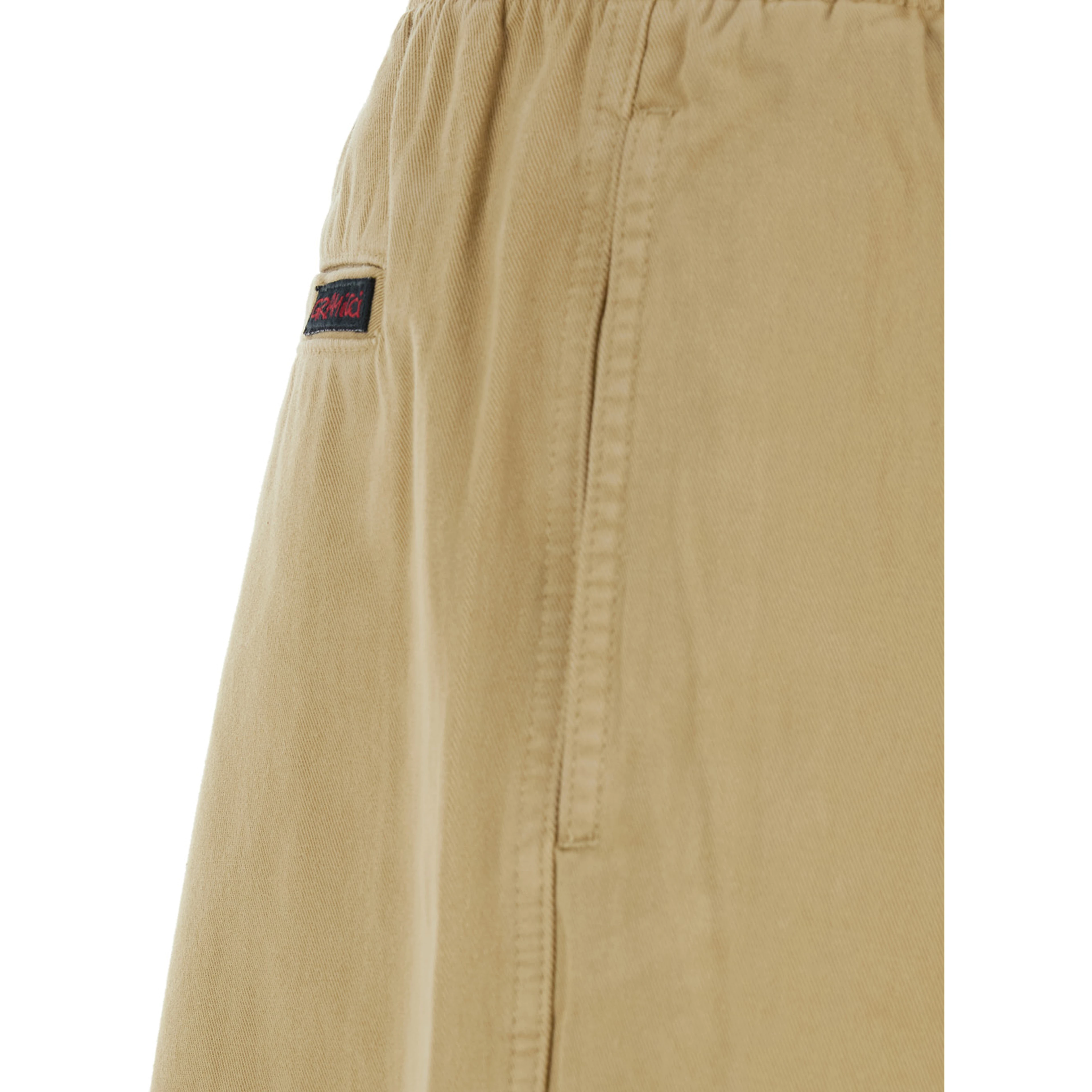 Beige pants with elasticated waist and contrasting bel