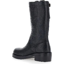 Black boots with decorative buckle and low heel in leather for women