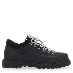 Black ankle boots with rubber lug sole and logo lettering on the tongue in leather for men