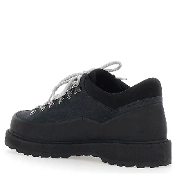 Black ankle boots with rubber lug sole and logo lettering on the tongue in leather for men