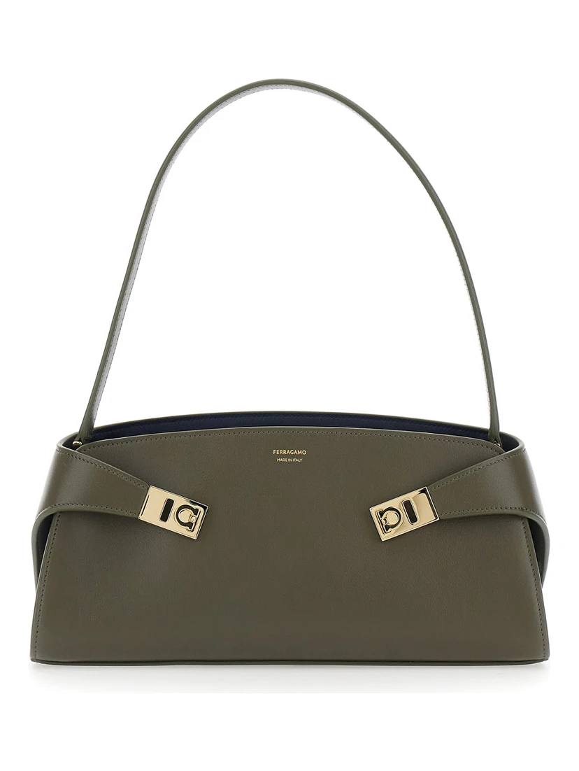 Hug East West Green Shoulder bag with shoulder strap and buckled belts on the front in leather for women