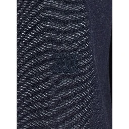 MOLO is a shirt with a classic collar and long sleeves in blue tech fabric for women