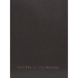 Brown beauty case with embossed logo lettering on the front in leather women