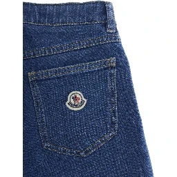 Five-pocket design jeans with logo patch on the back in blue denim for kids