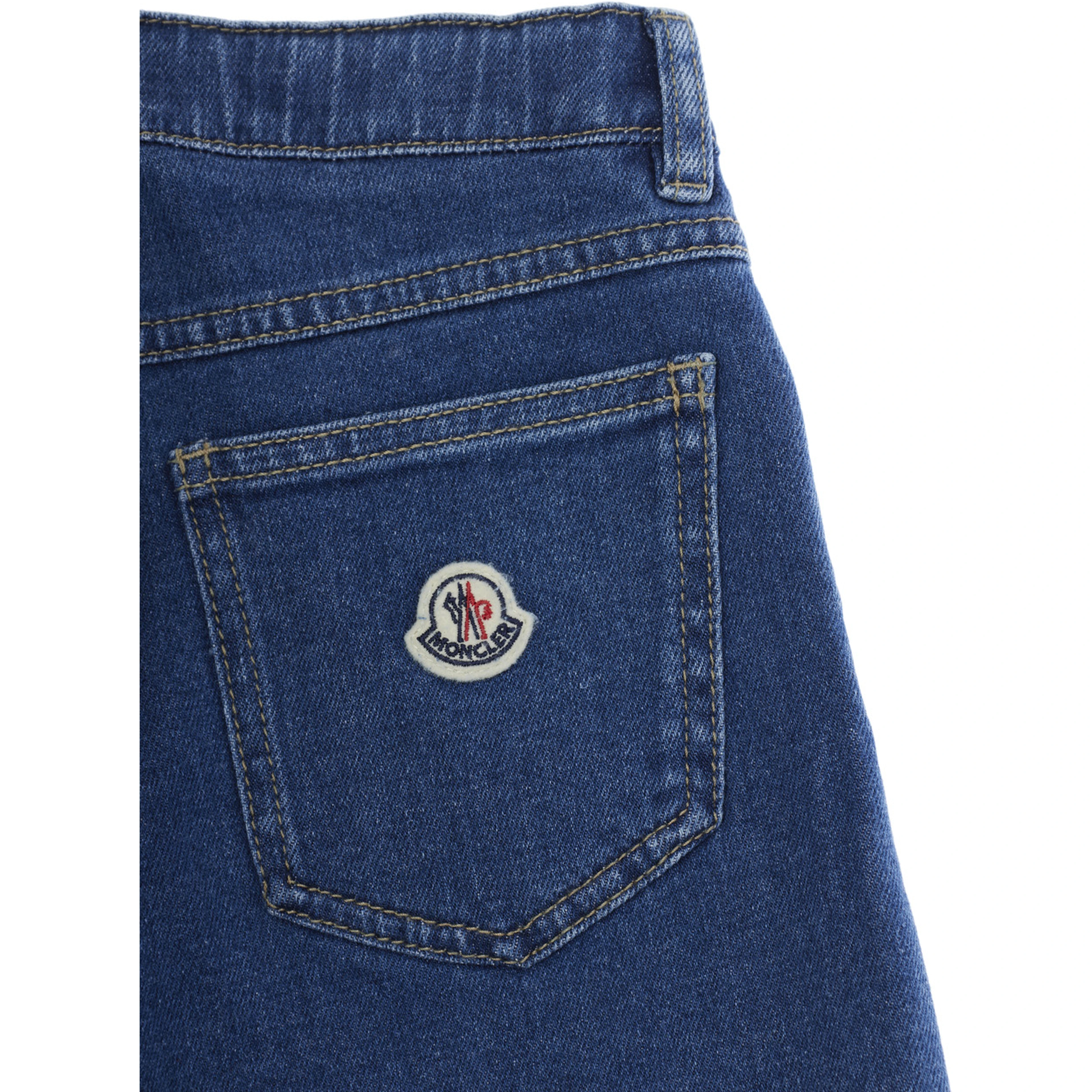 Five-pocket design jeans with logo patch on the back in blue denim for kids