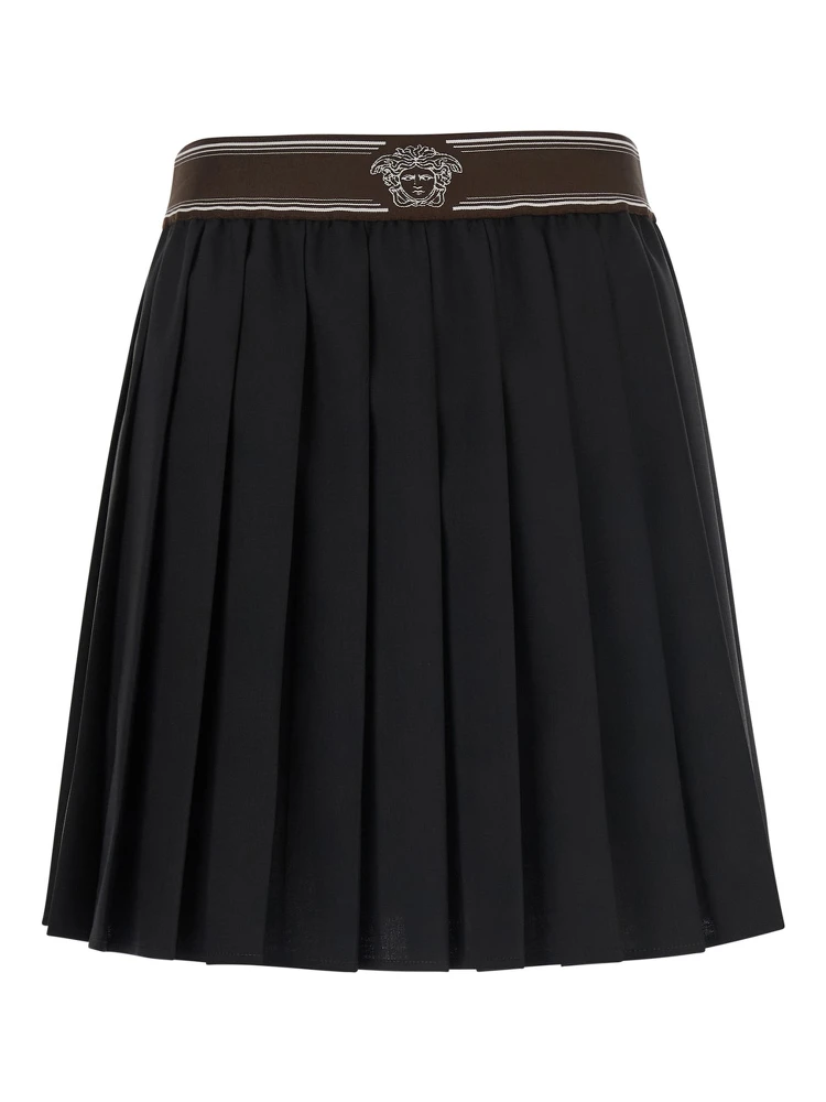 Black Pleated skirt with Medusa decoration at the waist in wool for women