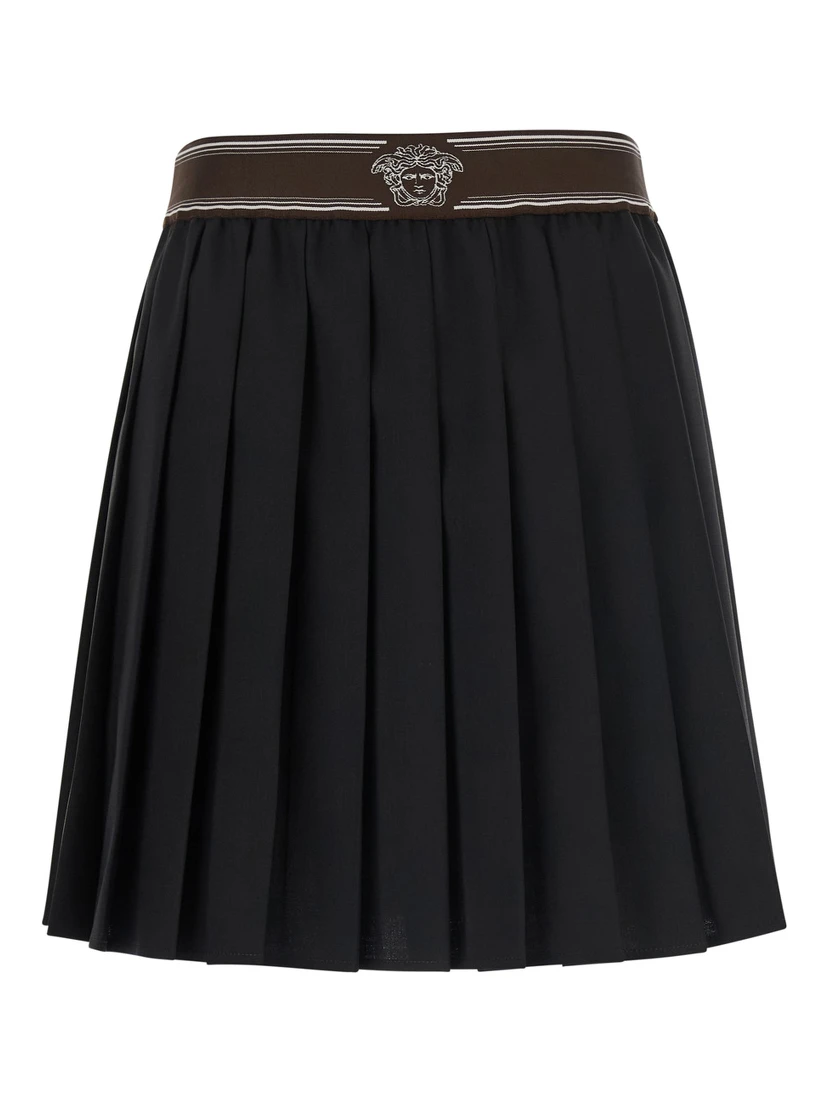 Black Pleated skirt with Medusa decoration at the waist in wool for women