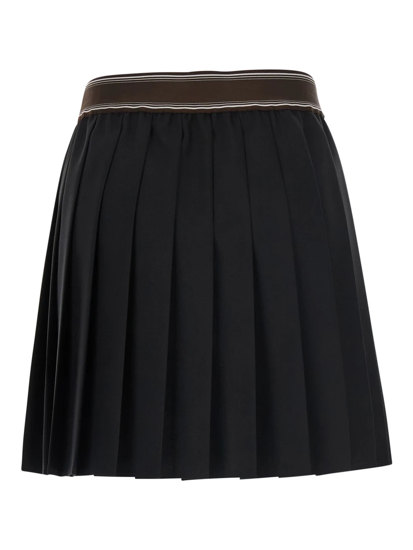 Black Pleated skirt with Medusa decoration at the waist in wool for women