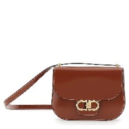 Brown crossbody bag with adjustable strap and Gancini plaque on the front in leather for women