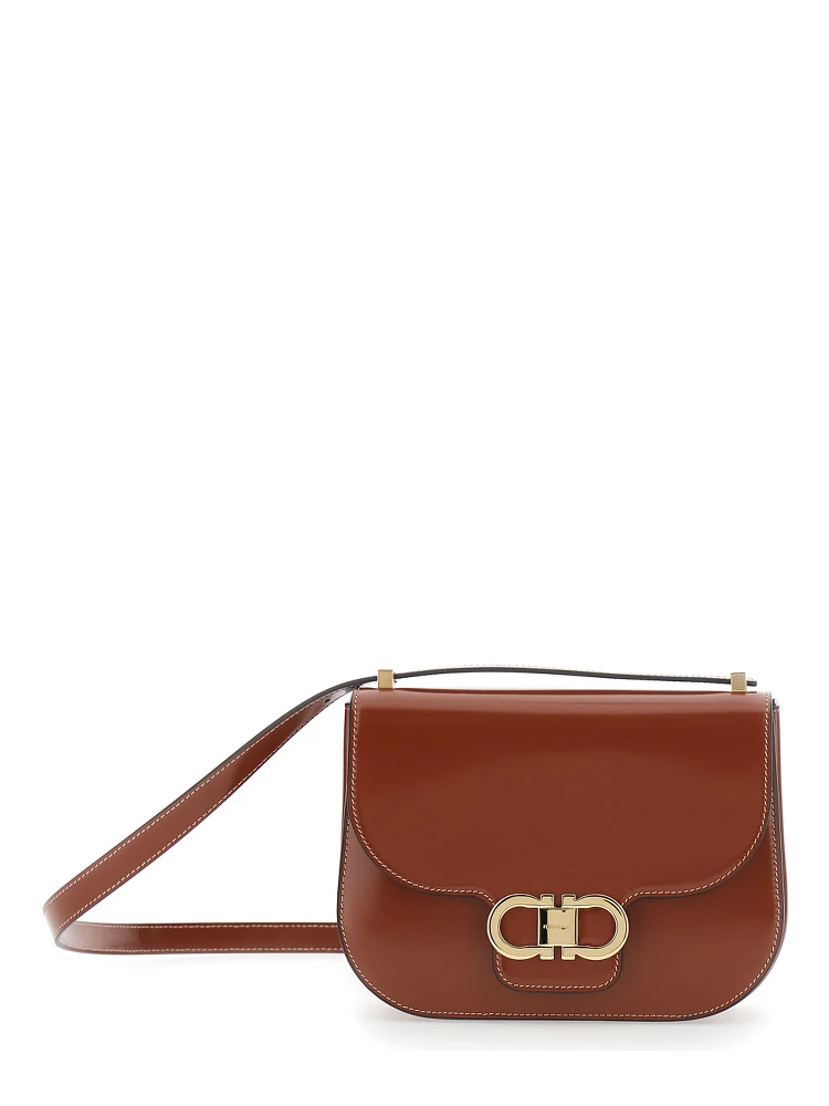 Brown crossbody bag with adjustable strap and Gancini plaque on the front in leather for women