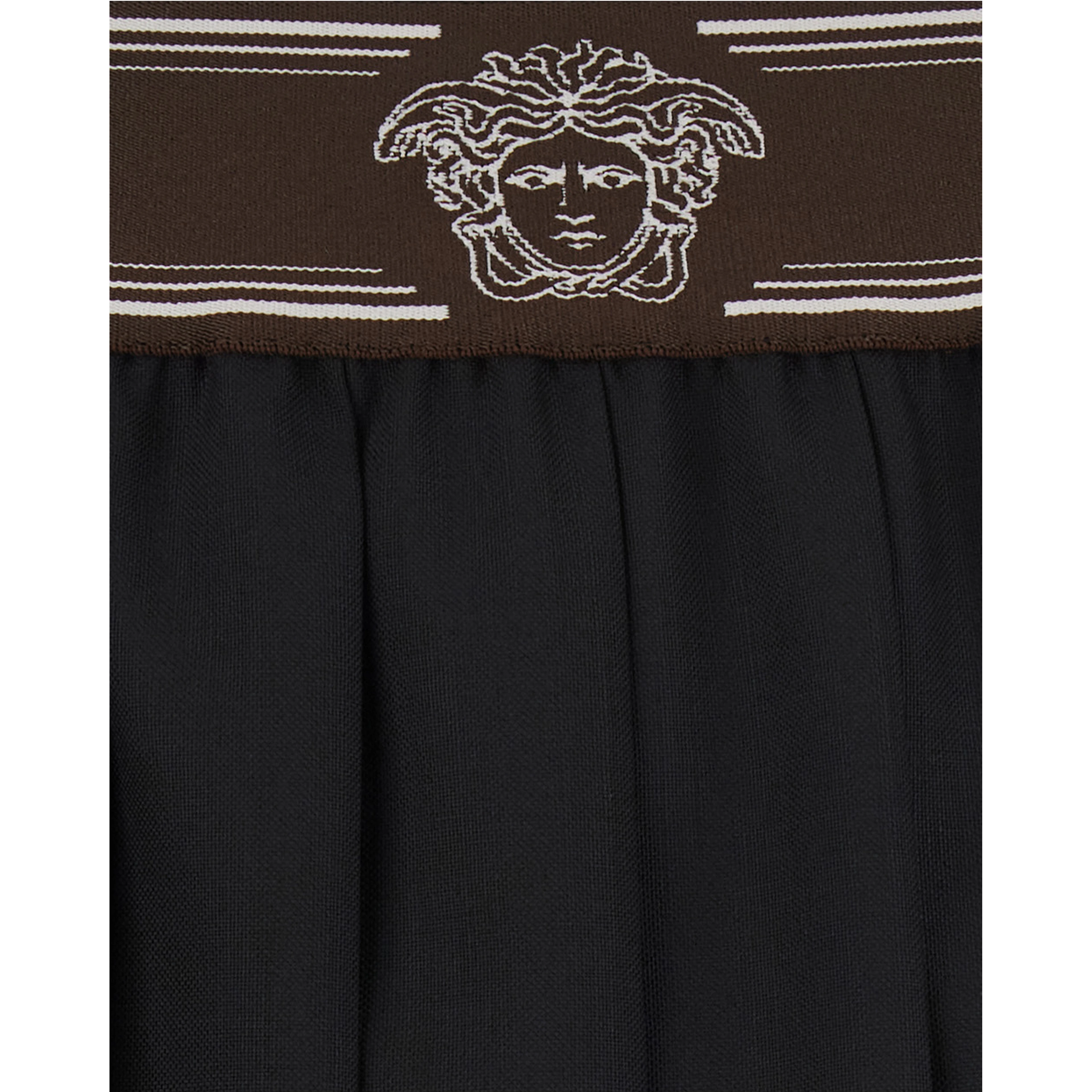 Black Pleated skirt with Medusa decoration at the waist in wool for women