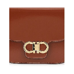 Brown crossbody bag with adjustable strap and Gancini plaque on the front in leather for women