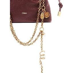 Icon Bordeaux handbag with sliding chain shoulder strap and charm in leather for women