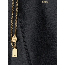 Shoulder Bag Spin with Logoed Metal Medals in Black Grained Leather for Women
