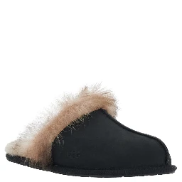 Black fur-lined mules in leather for women