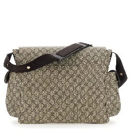Beige Crossbody changing  bag with adjustable strap and flap closure on the front in GG canvas baby