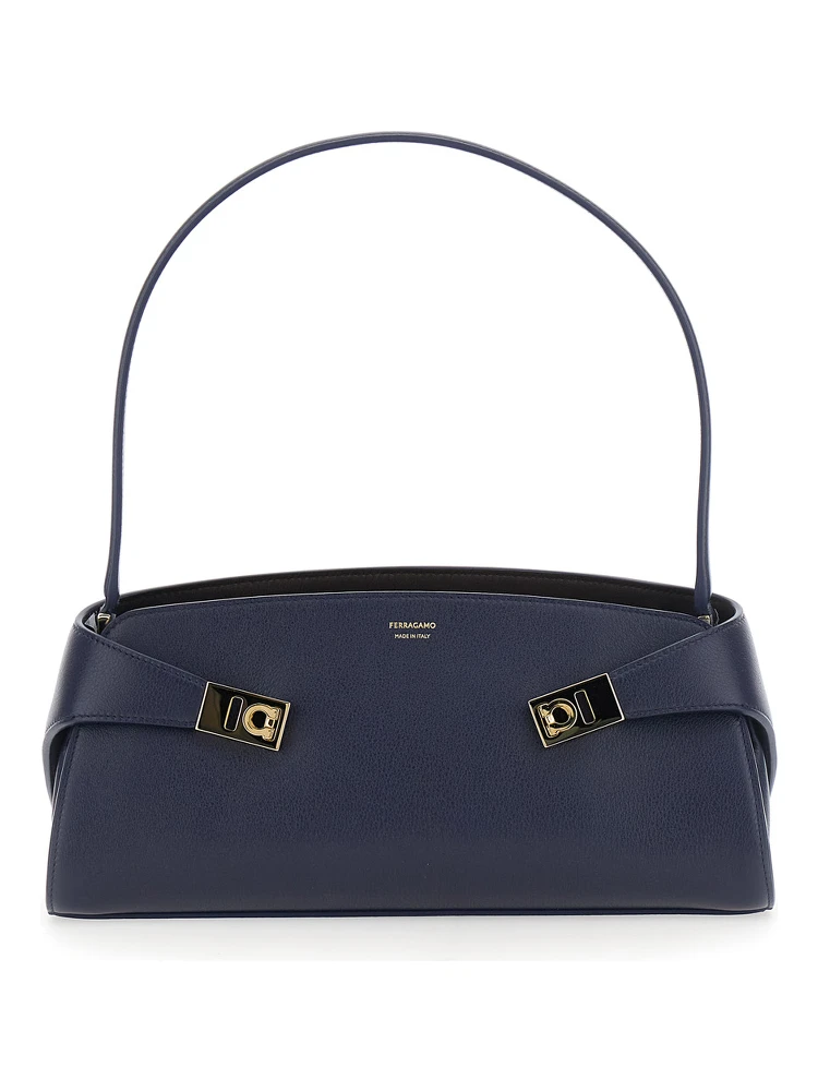 Hug East West Blue Shoulder bag with strap on the front and Logo lettering on the front in leather for women