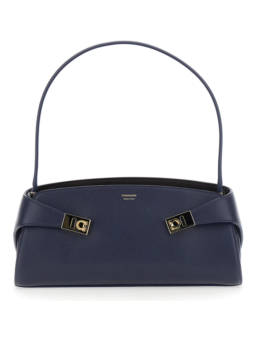 Hug East West Blue Shoulder bag with strap on the front and Logo lettering on the front in leather for women