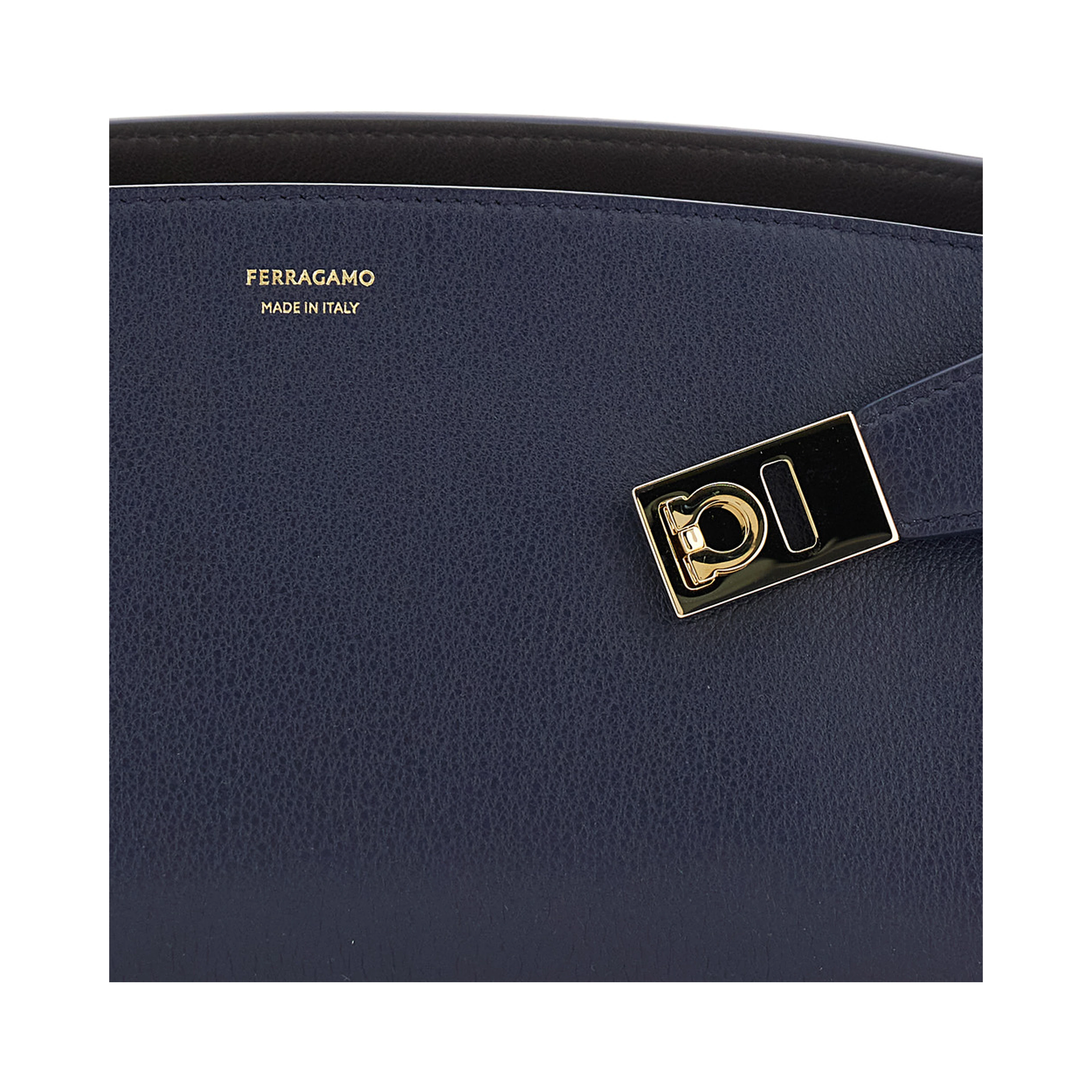 Hug East West Blue Shoulder bag with strap on the front and Logo lettering on the front in leather for women