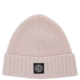 Pink beanie with turn-up brim and logo patch on the front in blend wool boy