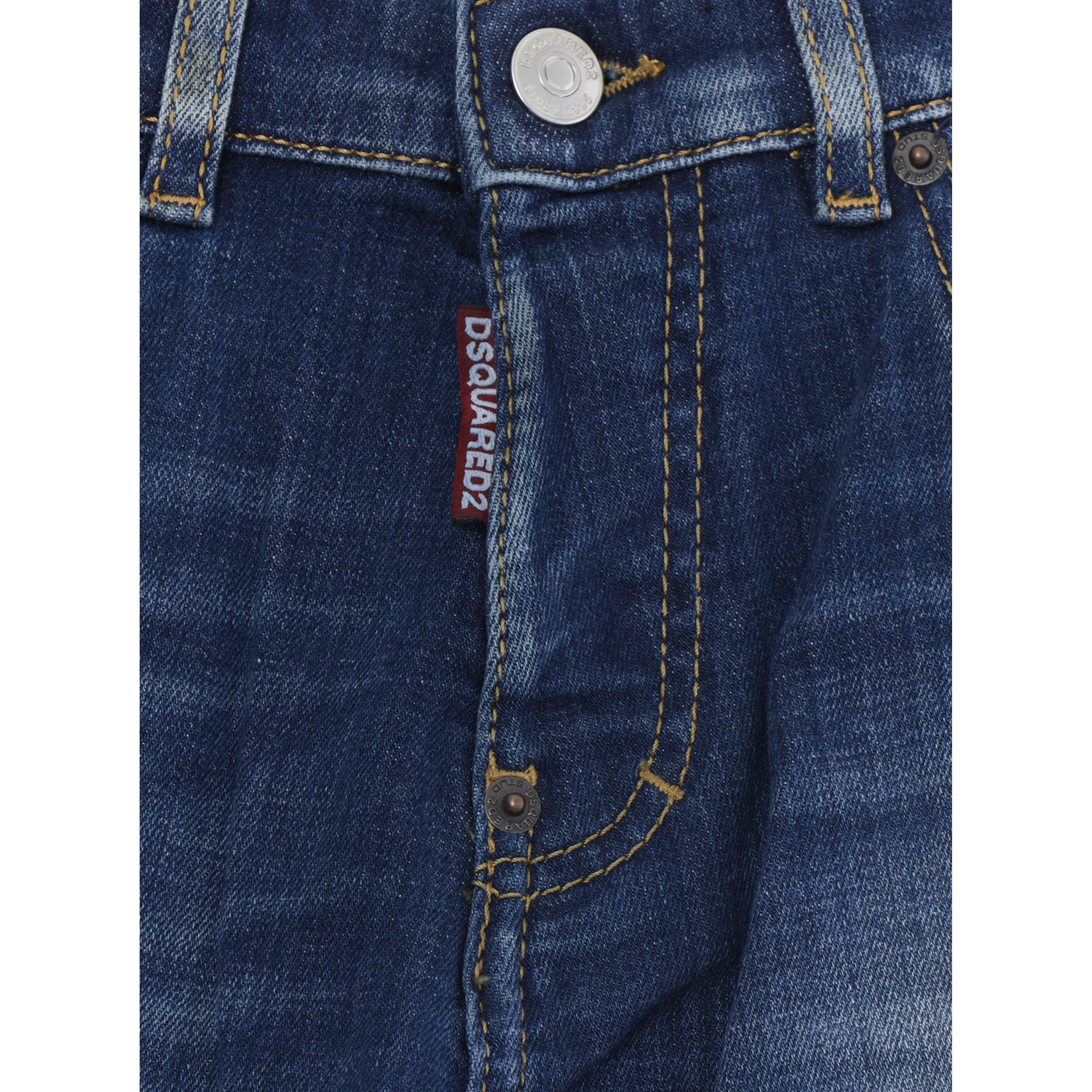 Blue Jeans with ripped details on the front and logo patch on the back in denim Boy