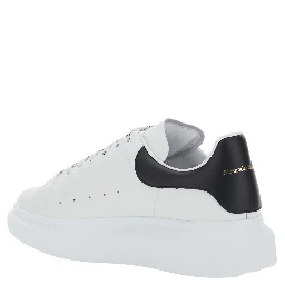 Low Top Sneaker Alexander McQueen with logo lettering on tongue and contrasting heel in white and black leather for men