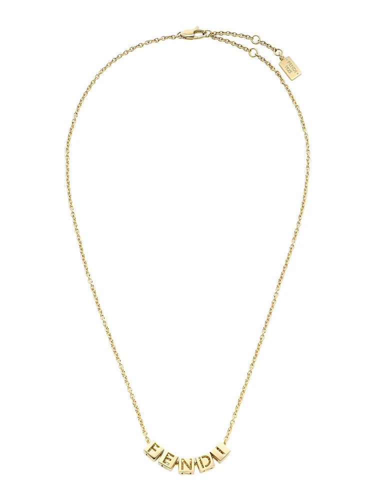 Gold-colored Necklace with lobster clasp at the back and cubes with Logo lettering in metal for women