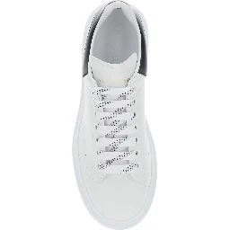 Low Top Sneaker Alexander McQueen with logo lettering on tongue and contrasting heel in white and black leather for men
