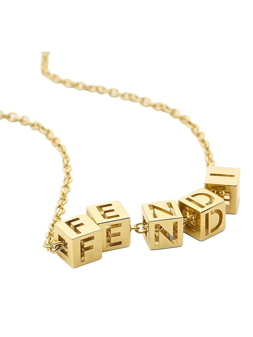 Gold-colored Necklace with lobster clasp at the back and cubes with Logo lettering in metal for women