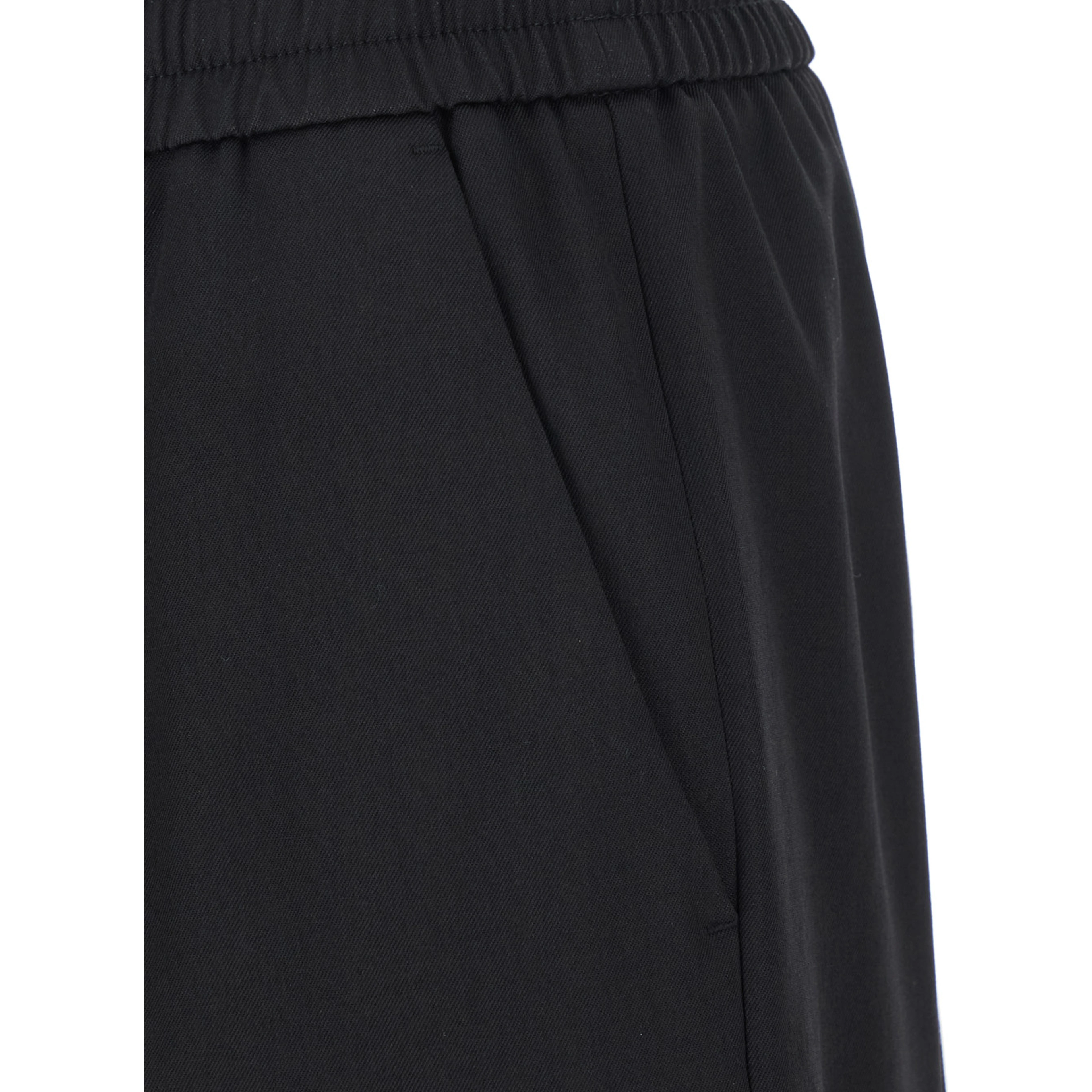Joggers with pockets and ribbed hems in black Virgin wool for men