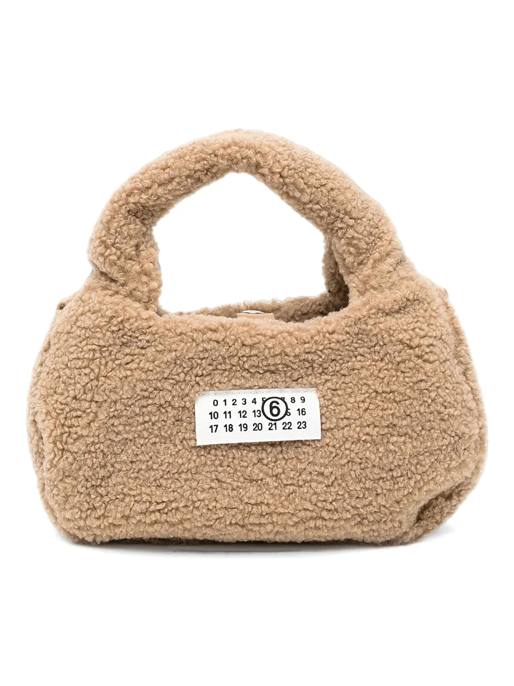 Brown Crossbody bag with logo patch on the front and shoulder strap in eco fur girl