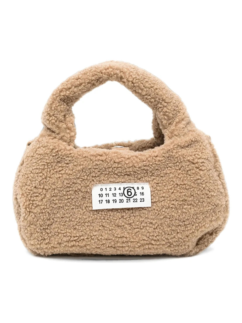 Brown Crossbody bag with logo patch on the front and shoulder strap in eco fur girl