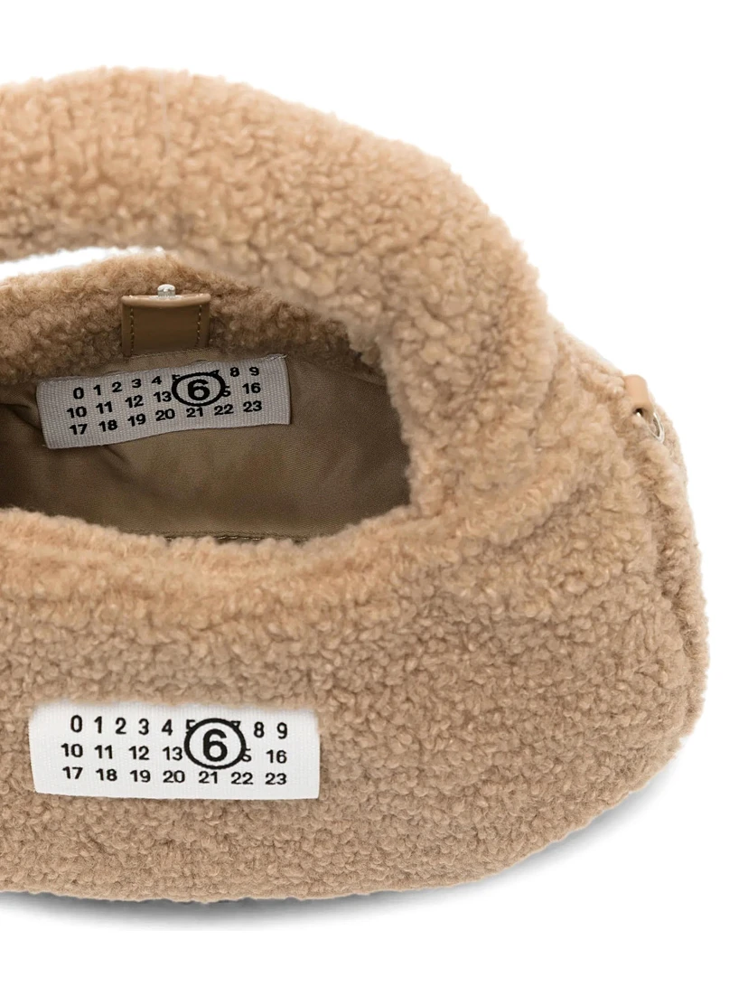 Brown Crossbody bag with logo patch on the front and shoulder strap in eco fur girl