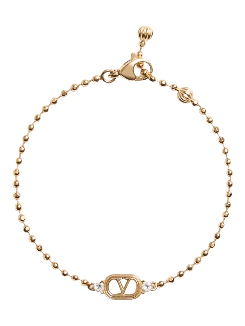 metallic colored Bracelet with Vlogo plate and applied rhinestones in brass for women