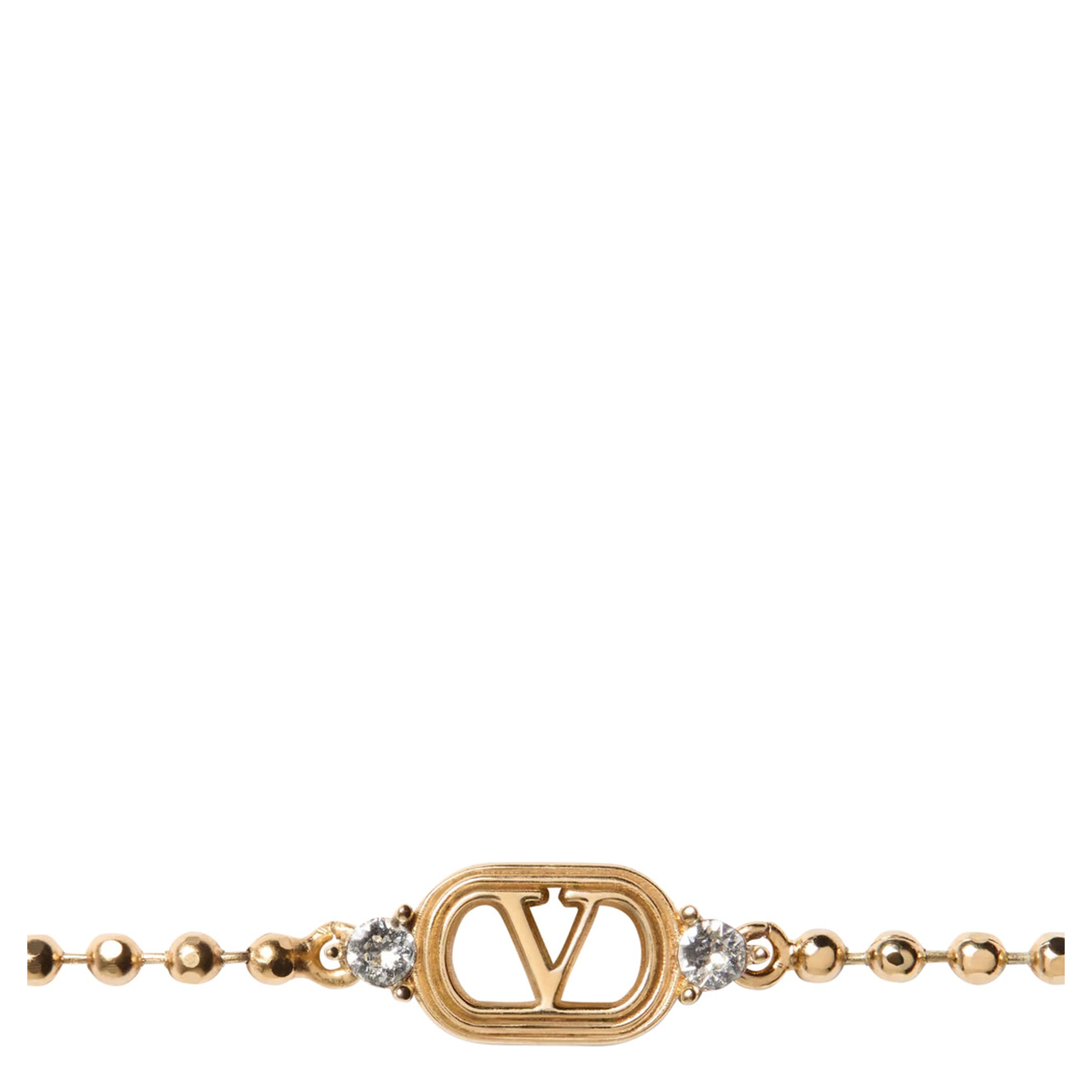 metallic colored Bracelet with Vlogo plate and applied rhinestones in brass for women