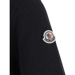 Black Polo Shirt with classic collar and logo patch on the sleeve in cotton for men