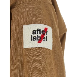 USHUAIA SHORT PARKA with collar, long sleeves and front closure. Tech Fabric, beige color, unisex