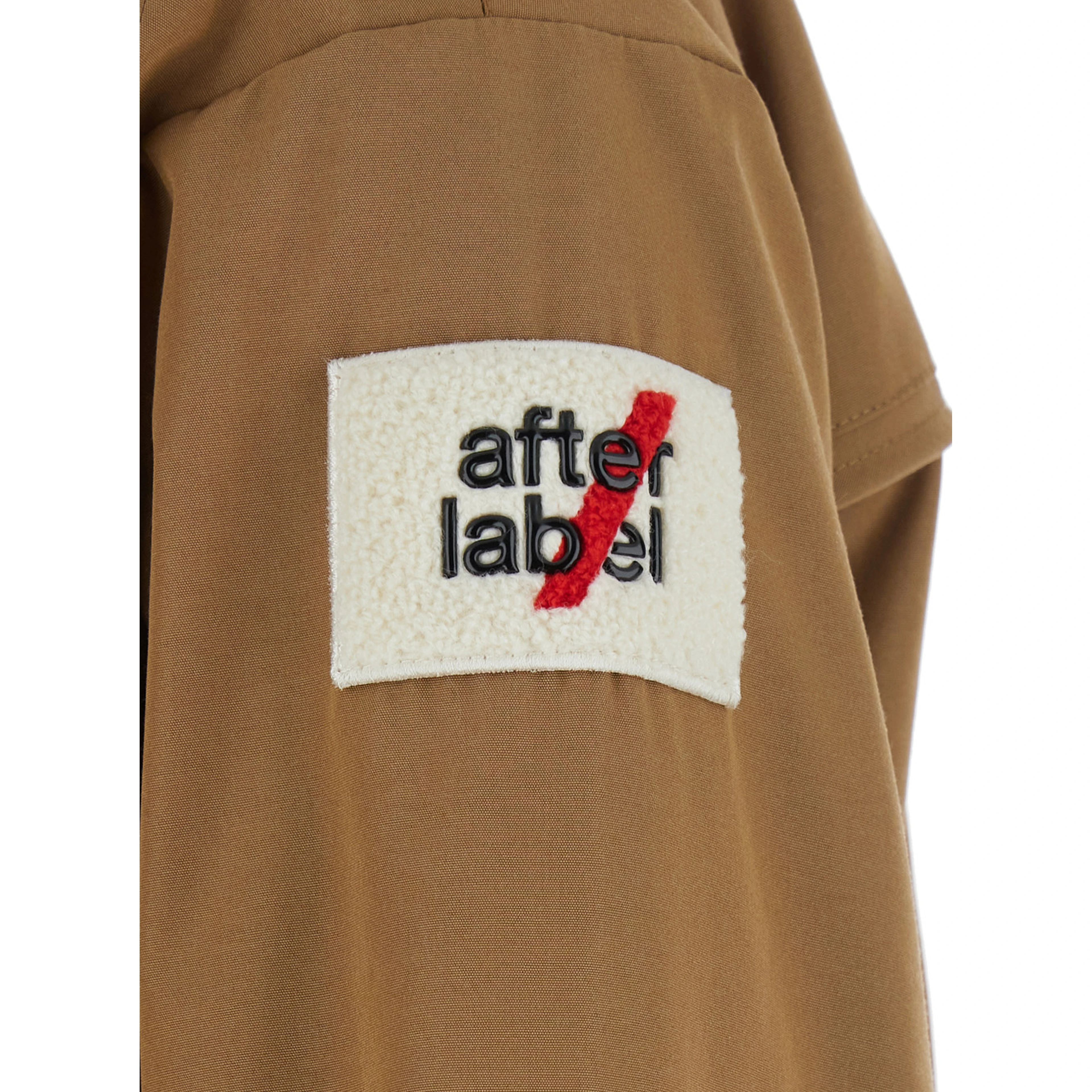 USHUAIA SHORT PARKA with collar, long sleeves and front closure. Tech Fabric, beige color, unisex
