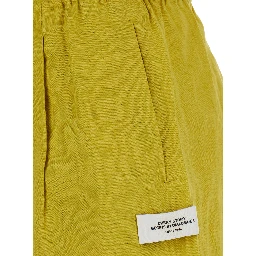 Tam Tam yellow Shorts with applied logo patch in linen for women